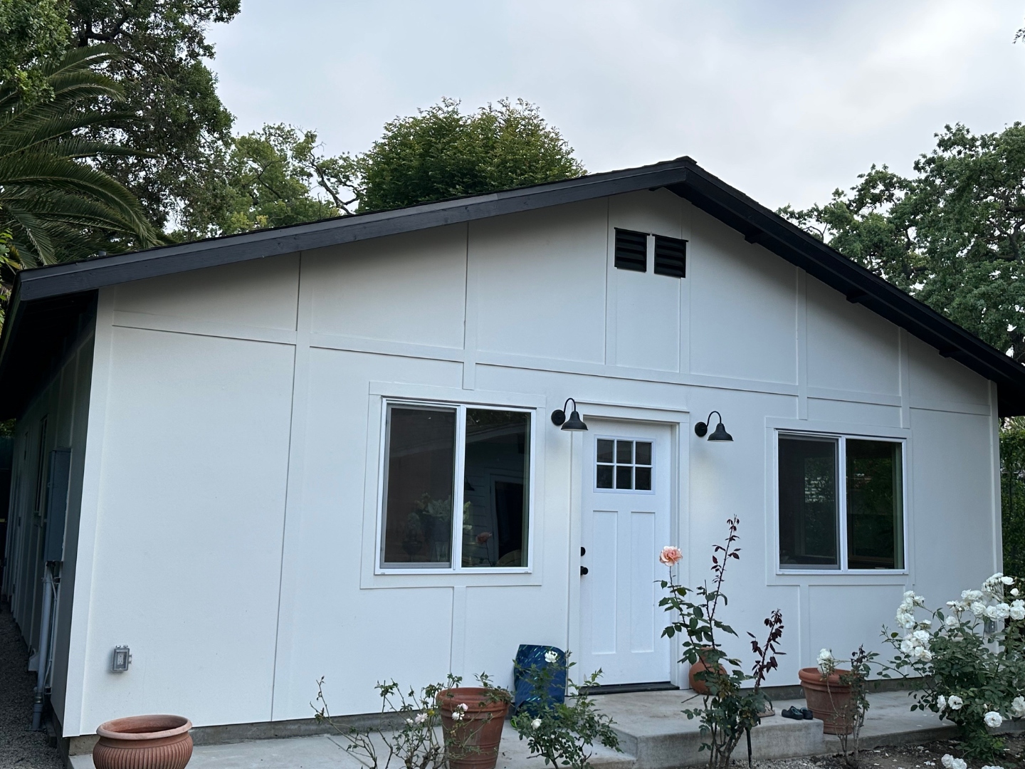 Completed detached ADU in Thousand Oaks — board and batten white exterior with black trim