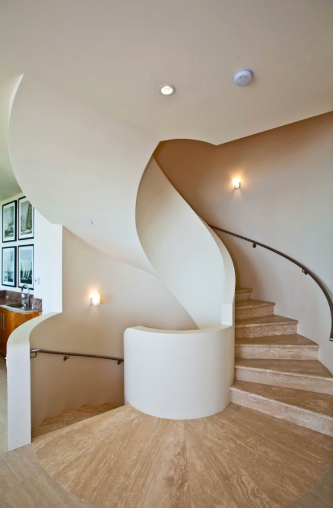 Architectural spiral staircase with travertine steps